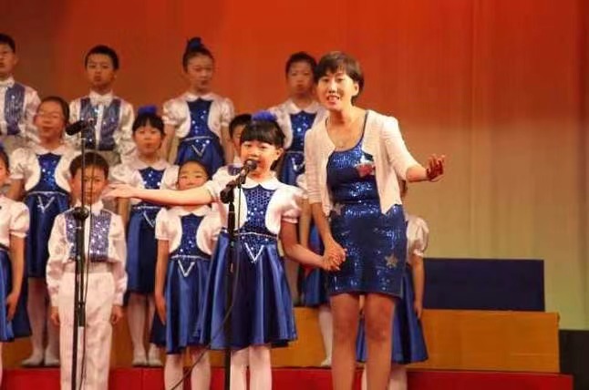 Children singing on stage